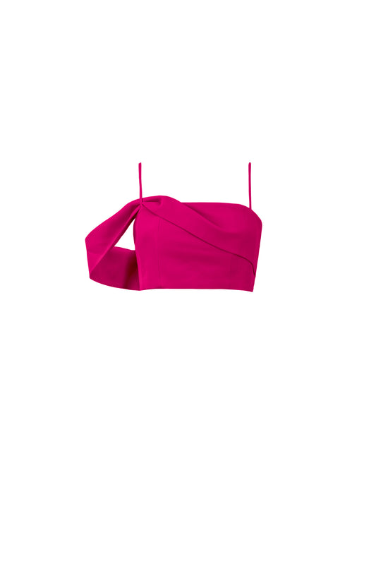 Product shot of asymmetric off shoulder crop top in hot pink